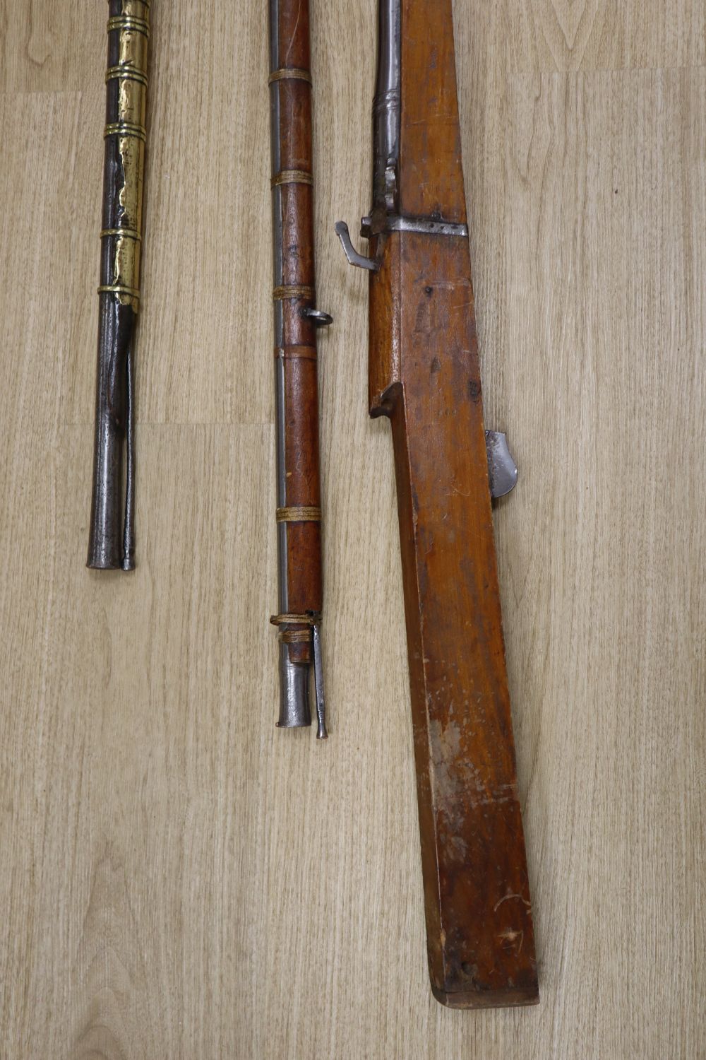 A long musket, overall 90 inches and two further longarms, all with ram-rods